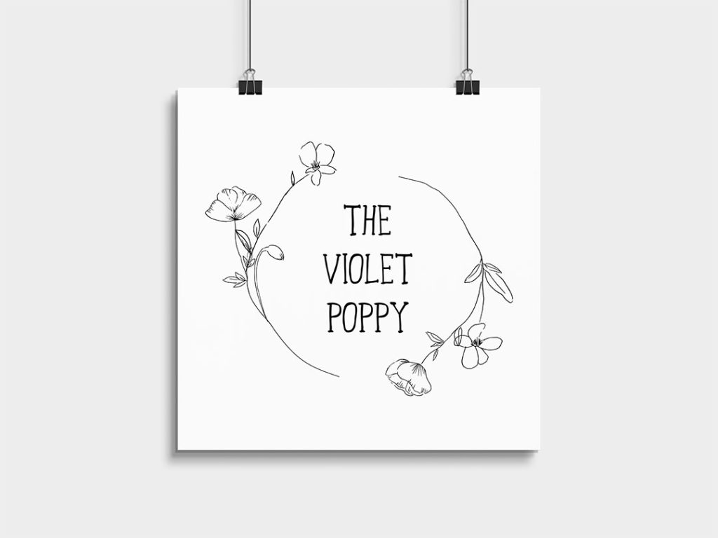 The Violet Poppy logo in a sheet of paper